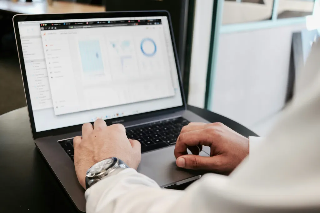 Advisor reviewing data on a laptop